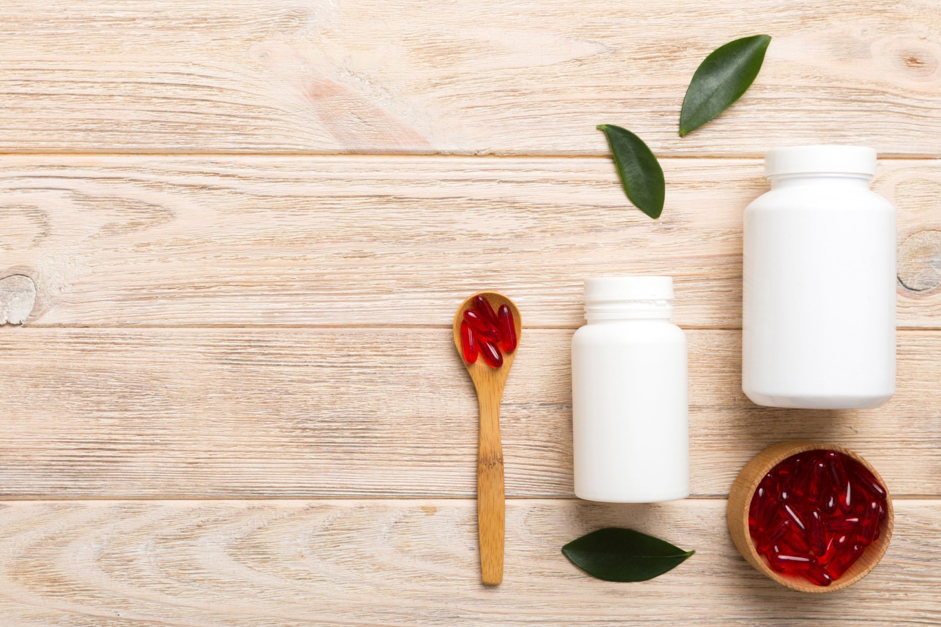 different drugs and health supplement pills with medicine bottle health care and medical top view. Vitamin tablets. Bottle with colored pills on table background. Multivitamins